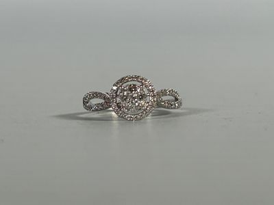 an image of a diamond ring on a table