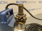 a close up of a water pump with a hose attached to it