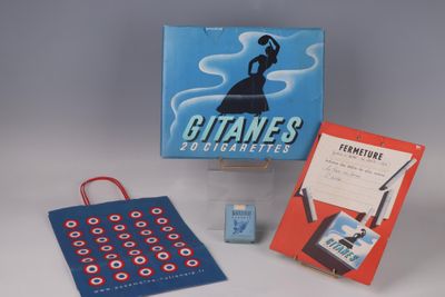 a box of cigarettes and a card game on the table