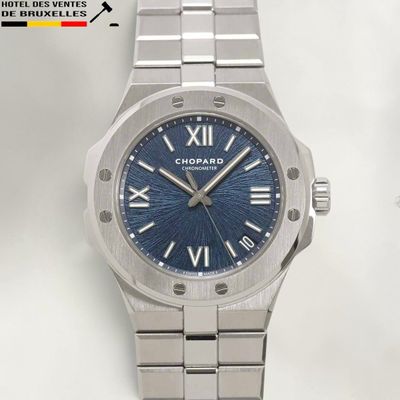 an image of a close up of a watch on a white surface