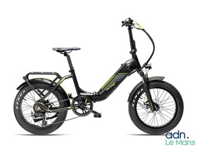 a close up of a black and green electric bike on a white background