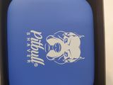 a blue frisbee in a black box on a white table