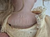 a close up of a woman ' s neck with a tattoo on it