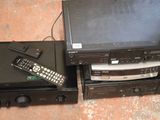 two remotes and a dvd player next to each other