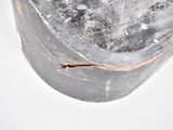 an old metal container with a handle on a white surface