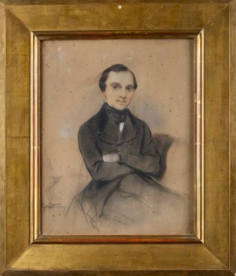 an old picture of a man in a suit sitting in front of a wall