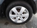 a close up of a tire on a car ' s rim