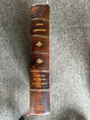 a close up of a book on a stand on a carpet