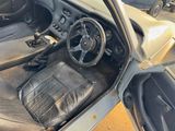 a picture of the interior of a car with leather seats and a steering wheel
