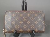 an image of a louis vuitton purse on a stand