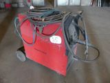 an image of a welding machine in a garage