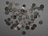 a lot of coins that are on the table