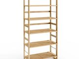 a close up of a wooden shelf with four shelves on it