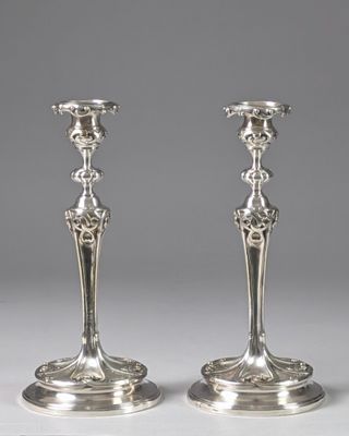 pair of antique silver candlesticks on stands