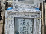 a pile of old picture frames sitting on top of a pallet