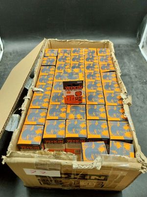 a box of beer sitting on a table next to a can of beer