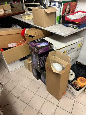 a pile of boxes sitting on the floor in a room