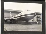 a black and white photo of an airplane on the tarmac