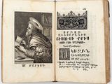 an old book with a picture of a man sitting at a table