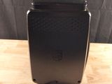an image of a black toaster sitting on top of a wooden table