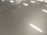 the floor is shiny and shiny with a lot of light coming through it