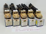 a lot of toy trucks that are lined up on a table