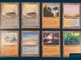many cards of different colors and designs on a blue background