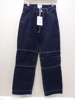 a close up of a pair of jeans hanging on a hanger