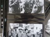 several black and white photos of soldiers in military uniforms on a table