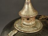 a black and silver vase sitting on a table