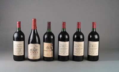 six bottles of wine are lined up in a row on a table