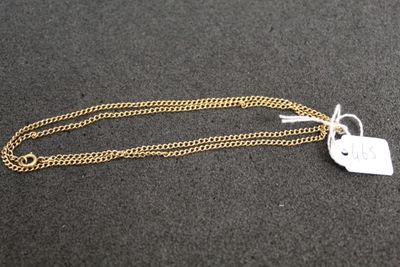 a close up of a gold chain with a tag on it