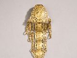 an image of a gold plated brooch with chains and beads