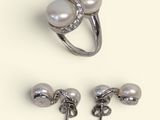 three pieces of jewelry including a ring, earring and a pair of earrings