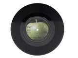 a black vinyl record with a picture of an apple on it