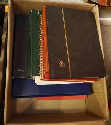 a lot of books in a box on the floor