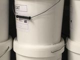 several white buckets stacked on top of each other on a shelf
