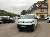 a white van that is parked in front of a building