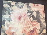 a picture of a painting of flowers on a table