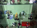 many figurines on display in a glass case