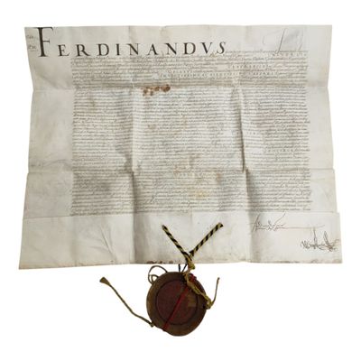 un gros plan sur un morceau de papier portant un cachet de cire