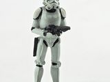 a toy figure of a stormtrooper holding a gun