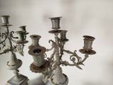 a silver candelab with a bunch of candles on it