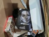 a cardboard box filled with assorted items in it