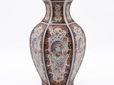 a vase with a design on it on a white background