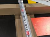 a measuring tape that is on top of a piece of paper