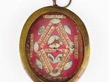 a picture of a pocket watch with a picture on it
