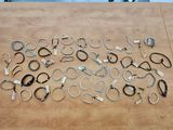 many different types of scissors on a wooden table