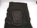 a close up of a pair of black pants with a knee pad