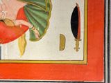 a painting on the wall of a room with a painting of a woman